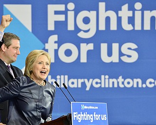 Jeff Lange | The Vindicator  SAT, MAR 12, 2016 - Democratic presidential candidate Hillary Clinton speaks as U.S. Rep. Tim Ryan pumps his fist during her campaign rally in Youngstown Saturday night.