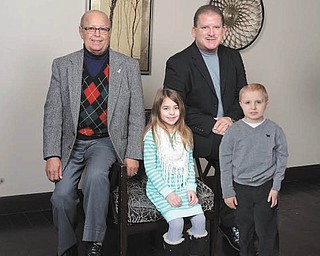 SPECIAL TO THE VINDICATOR | Honorees at the April 2 Cattle Baron’s Ball presented by the American Cancer Society are, from left seated, Dr. Rashid Abdu, medical honoree, and Stephen Burbrink, survivor honoree, and returning childhood cancer honorees, Ava Timko and Brett Wilcox, both 8 years old.