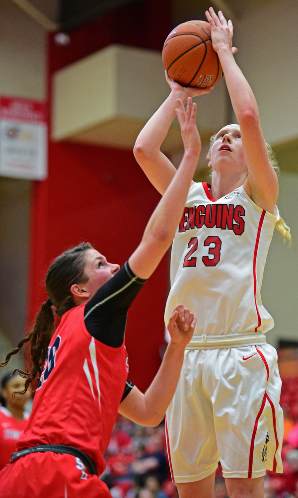 YOUNGSTOWN, OHIO - MARCH 16, 2016: Sarah Cash #23 of YSU put up a shot under the basket over Brittany Snow #20 of Stoney Brook during their 2nd half of their game Wednesday night at Beeghly Center. DAVID DERMER | THE VINDICATOR