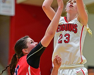 YOUNGSTOWN, OHIO - MARCH 16, 2016: Sarah Cash #23 of YSU put up a shot under the basket over Brittany Snow #20 of Stoney Brook during their 2nd half of their game Wednesday night at Beeghly Center. DAVID DERMER | THE VINDICATOR
