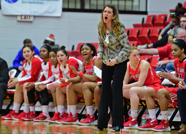 YOUNGSTOWN, OHIO - MARCH 16, 2016: Head coach Caroline McCombs of Stoney Brook shots instructions from the sideline during their 2nd half of their game Wednesday night at Beeghly Center. DAVID DERMER | THE VINDICATOR