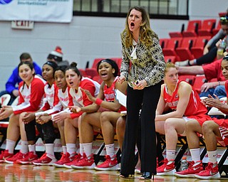 YOUNGSTOWN, OHIO - MARCH 16, 2016: Head coach Caroline McCombs of Stoney Brook shots instructions from the sideline during their 2nd half of their game Wednesday night at Beeghly Center. DAVID DERMER | THE VINDICATOR