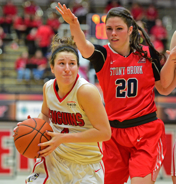 YOUNGSTOWN, OHIO - MARCH 16, 2016: Nikki Arbanas #4 of YSU drives to the basket after getting around Brittany Snow #20 of Stoney Brook during their 2nd half of their game Wednesday night at Beeghly Center. DAVID DERMER | THE VINDICATOR