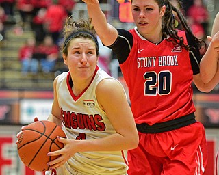 YOUNGSTOWN, OHIO - MARCH 16, 2016: Nikki Arbanas #4 of YSU drives to the basket after getting around Brittany Snow #20 of Stoney Brook during their 2nd half of their game Wednesday night at Beeghly Center. DAVID DERMER | THE VINDICATOR