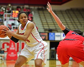YOUNGSTOWN, OHIO - MARCH 16, 2016: Janae Jackson #44 of YSU goes to the basket after Brittany Snow #20 of Stoney Brook lost her balance while playing defense during their 2nd half of their game Wednesday night at Beeghly Center. DAVID DERMER | THE VINDICATOR