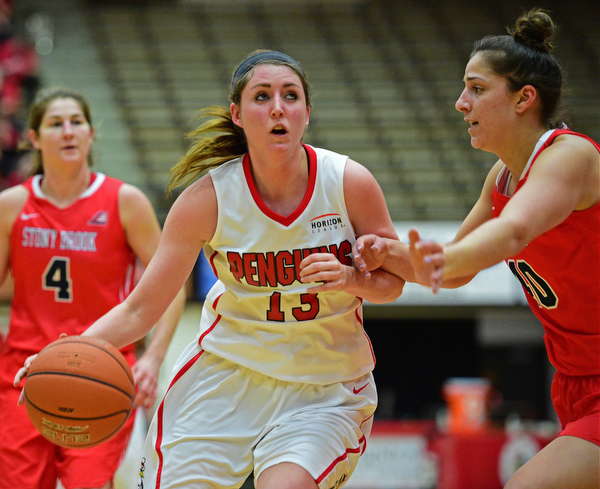YOUNGSTOWN, OHIO - MARCH 16, 2016: Kelsea Newman #13 of YSU gets to the basket while Alyssa Coiro #40 of Stoney Brook closes in to guard her during their 2nd half of their game Wednesday night at Beeghly Center. DAVID DERMER | THE VINDICATOR