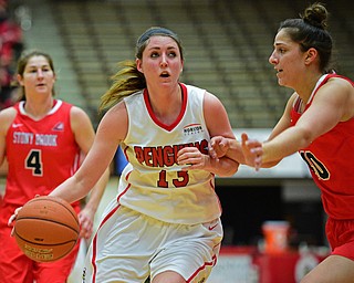 YOUNGSTOWN, OHIO - MARCH 16, 2016: Kelsea Newman #13 of YSU gets to the basket while Alyssa Coiro #40 of Stoney Brook closes in to guard her during their 2nd half of their game Wednesday night at Beeghly Center. DAVID DERMER | THE VINDICATOR