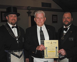 SPECIAL TO THE VINDICATOR
At a recent meeting of Argus Masonic Lodge 545 in Canfield, Kenneth L. Matheny of Lake Milton was given a gold pin to mark his 50 years of service to the club. Guests to the meeting included Robert W. Ridzon and Matheny’s family. Master of ceremonies and photographer for the occasion was Denny Furman. Ryan H. Hamilton, left, presented the pin to Matheny with assistance from Ridzon. For information about Masons, visit www.freemason.com. For local information, go to www.arguslodge.info or contact Russell W. Gillam III at 330-953-7935.