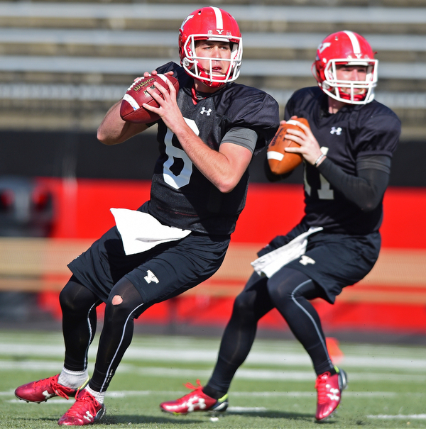 YOUNGSTOWN, OHIO - MARCH 18, 2016: Hunter Wells (left) and Trent Hosick (right) drop back to pass during a passing drill during the teams practice Friday afternoon at Stambaugh Stadium. DAVID DERMER | THE VINDICATOR