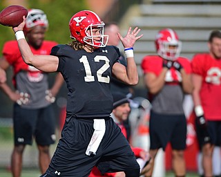YOUNGSTOWN, OHIO - MARCH 18, 2016: Ricky Davis #12 of YSU throws a pass during a drill during the teams practice Friday afternoon at Stambaugh Stadium. DAVID DERMER | THE VINDICATOR