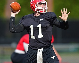 YOUNGSTOWN, OHIO - MARCH 18, 2016: Trent Hosick #11 of YSU throws a pass during a drill during the teams practice Friday afternoon at Stambaugh Stadium. DAVID DERMER | THE VINDICATOR