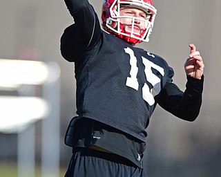 YOUNGSTOWN, OHIO - MARCH 18, 2016: Jon Saadey #15 of YSU throws a pass during a drill during the teams practice Friday afternoon at Stambaugh Stadium. DAVID DERMER | THE VINDICATOR