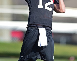 YOUNGSTOWN, OHIO - MARCH 18, 2016: Ricky Davis #12 of YSU throws a pass during a drill during the teams practice Friday afternoon at Stambaugh Stadium. DAVID DERMER | THE VINDICATOR