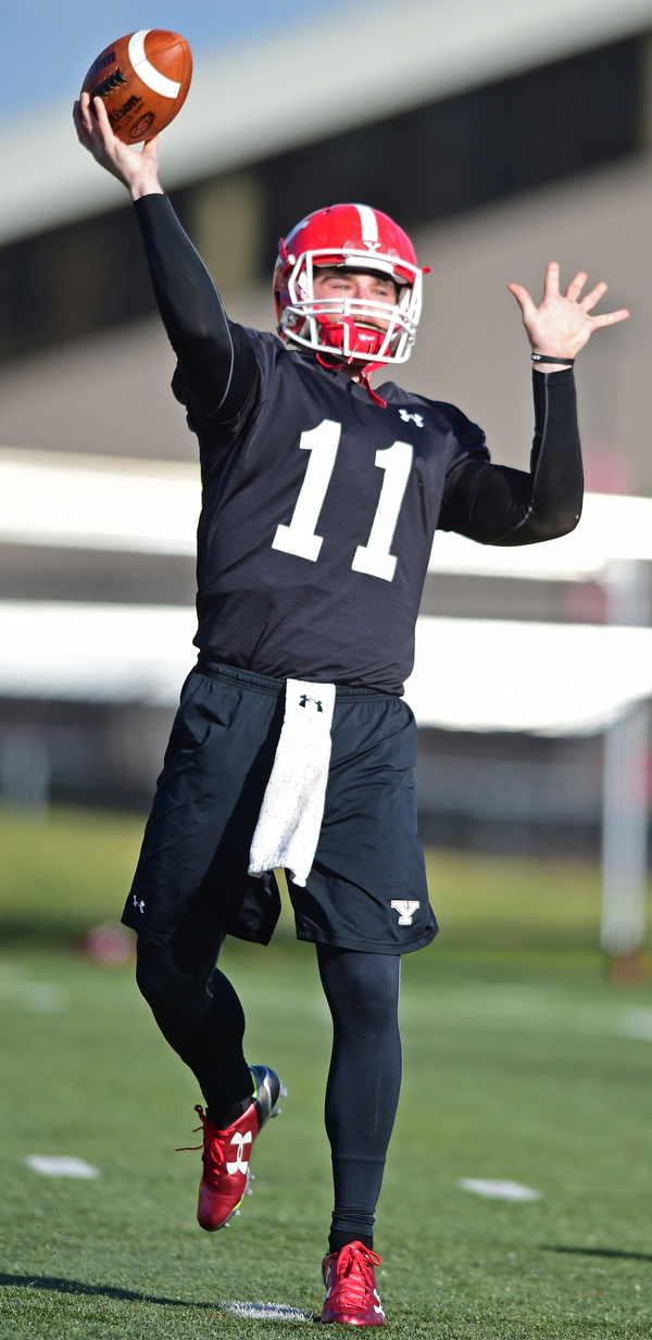YOUNGSTOWN, OHIO - MARCH 18, 2016: Trent Hosick #11 of YSU throws a pass during a drill during the teams practice Friday afternoon at Stambaugh Stadium. DAVID DERMER | THE VINDICATOR