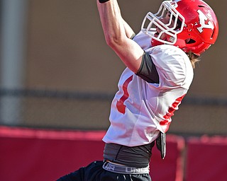 YOUNGSTOWN, OHIO - MARCH 18, 2016: Ryan Emans #81 of YSU catches a pass in the corner of the end zone during a passing drill during the teams practice Friday afternoon at Stambaugh Stadium. DAVID DERMER | THE VINDICATOR