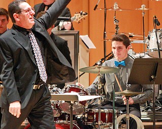 William d Lewis the vindiator  Boardman band direcotr Tom Ruggieri leads the Boardman HS Jazz Esemble 1 during a 3-19-16 concert at Powers Auditorium in youngstown. On drums is his son Nico, a senior at Boardman HS. they opened for the Buddy Rich Band.