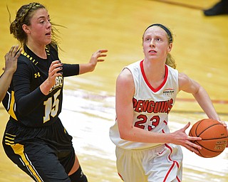 YOUNGSTOWN, OHIO - MARCH 19, 2016: Sarah Cash #23 of YSU looks to the basket Amanda Hagaman #15 of UMBC closes in to defend the basket during the 1st half of their game Saturday afternoon at Beeghly Center. YSU won 67-48. DAVID DERMER | THE VINDICATOR