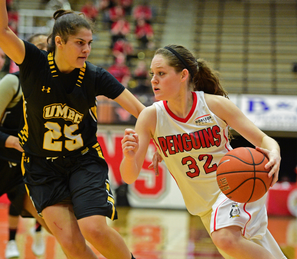 YOUNGSTOWN, OHIO - MARCH 19, 2016: Jenna Hirsch #32 of YSU drives to the basket while being closely guarded by Laura Cataldo #25 of UMBC during the 2nd half of their game Saturday afternoon at Beeghly Center. YSU won 67-48. DAVID DERMER | THE VINDICATOR