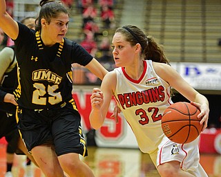 YOUNGSTOWN, OHIO - MARCH 19, 2016: Jenna Hirsch #32 of YSU drives to the basket while being closely guarded by Laura Cataldo #25 of UMBC during the 2nd half of their game Saturday afternoon at Beeghly Center. YSU won 67-48. DAVID DERMER | THE VINDICATOR