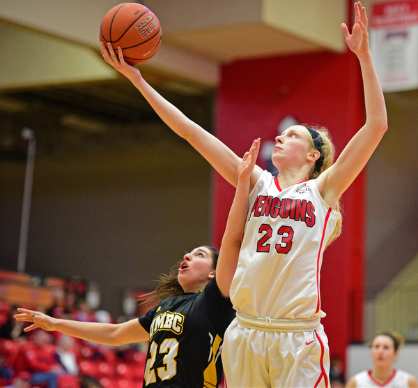 YOUNGSTOWN, OHIO - MARCH 19, 2016: Sarah Cash #23 of YSU jumps above Emily Russo #23 of UMBC to grab a rebound during the 2nd half of their game Saturday afternoon at Beeghly Center. YSU won 67-48. DAVID DERMER | THE VINDICATOR