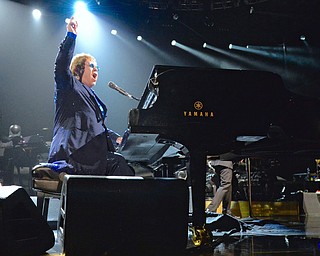 Jeff Lange | The Vindicator  TUE, MAR 22, 2016 - Elton John raises his hand above his head as he performs "Funeral For A Friend/Love Lies Bleeding at the beginning of his concert at the Covelli Centre Tuesday night.