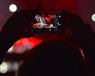 Jeff Lange | The Vindicator  TUE, MAR 22, 2016 - A fan snaps a cell phone photo as Elton John wows the crowd with a performance of "Bennie And The Jets" during his concert at the Covelli Centre in Youngstown Tuesday night.