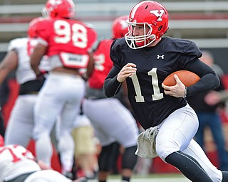 YOUNGSTOWN, OHIO - MARCH 23, 2016: Trent Hosick #11 of YSU runs the football to the outside after keeping it during the teams practice Wednesday afternoon at Stambaugh Stadium. DAVID DERMER | THE VINDICATOR
