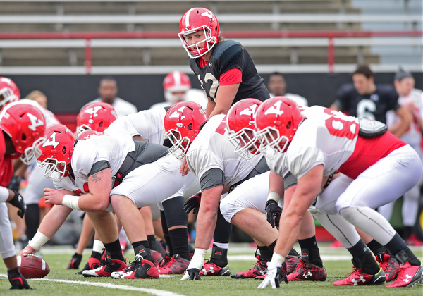 YOUNGSTOWN, OHIO - MARCH 23, 2016: Ricky Davis #12 of YSU examines the defense while calling the cadence before the snap of the football during the teams practice Wednesday afternoon at Stambaugh Stadium. DAVID DERMER | THE VINDICATOR