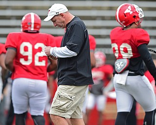 YOUNGSTOWN, OHIO - MARCH 23, 2016: Head coach Bo Pelini of YSU walks in between plays during the teams practice Wednesday afternoon at Stambaugh Stadium. DAVID DERMER | THE VINDICATOR