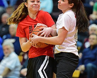 BOARD MAN, OHIO - MARCH 23, 2016: Lauren Falasca (red) of Western Reserve and Ali Cikinero (white) of Girard smile after getting tangled up while battling for a loose ball during the Al Beach Classic Girls All-Star Basketball game Wednesday night at Boardman High School. DAVID DERMER | THE VINDICATOR
