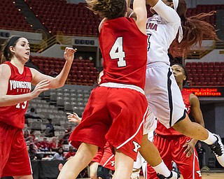 Advertiser photo by Buddy Delahoussaye-- Cajuns guard Keke Veal (24) with the jumper shot and draws the foul on Penguins guard Nikki Arbanas (4) in the first half of the semi-final matchup of the WBI tournament game between Youngstown State and the University of Louisiana at Lafayette on Wednesday night in the Cajun Dome.