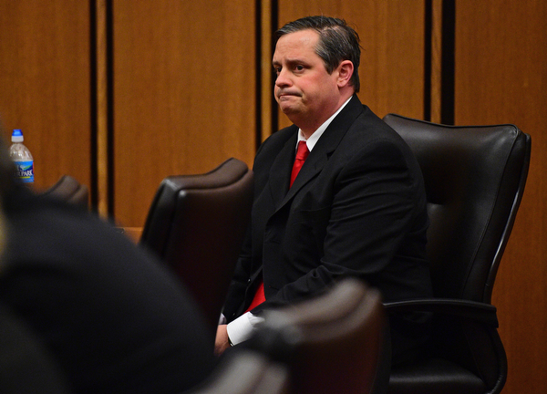 CLEVELAND, OHIO - MARCH 25, 2016: Attorney Martin Yavorcik grimaces upon hearing a guilty verdict on one of costs against him during court proceeding Friday afternoon at the Cleveland Municipal Court. DAVID DERMER | THE VINDICATOR