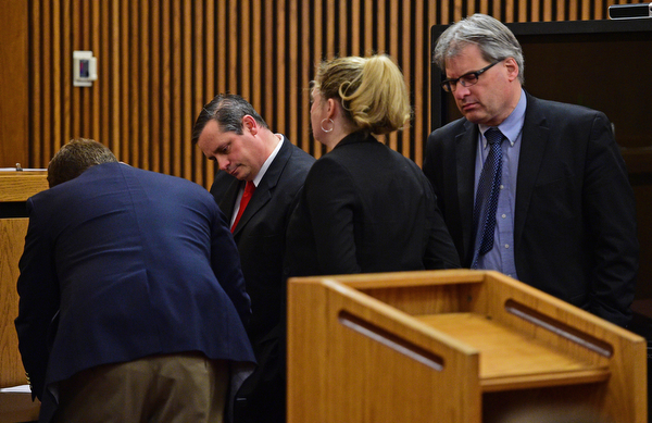 CLEVELAND, OHIO - MARCH 25, 2016: Attorney Martin Yavorcik and Leigh Bayer the Asst. Attorney General for Ohio and Matthew E. Meyer the Cuyahoga County Asst. Prosecutor looks at the verdict sheets during court proceeding Friday afternoon at the Cleveland Municipal Court. DAVID DERMER | THE VINDICATOR..Lead Prosecutor & Senior Asst. Ohio Attorney General Dan Kasaris pictured.