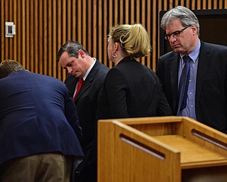 CLEVELAND, OHIO - MARCH 25, 2016: Attorney Martin Yavorcik and Leigh Bayer the Asst. Attorney General for Ohio and Matthew E. Meyer the Cuyahoga County Asst. Prosecutor looks at the verdict sheets during court proceeding Friday afternoon at the Cleveland Municipal Court. DAVID DERMER | THE VINDICATOR..Lead Prosecutor & Senior Asst. Ohio Attorney General Dan Kasaris pictured.