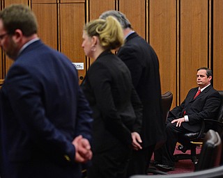 CLEVELAND, OHIO - MARCH 25, 2016: Attorney Martin Yavorcik sits at the defense table while Lead Prosecutor & Senior Asst. Ohio Attorney General Dan Kasaris, Leigh Bayer the Asst. Attorney General for Ohio and Matthew E. Meyer the Cuyahoga County Asst. Prosecutor speak to the judge during court proceeding Friday afternoon at the Cleveland Municipal Court. DAVID DERMER | THE VINDICATOR