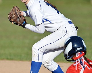 Jeff Lange | The Vindicator  TUE, MAR 29, 2016 - Poland second baseman Sarah Boccieri looks to first for a double play over Austintown baserunner Kayla Kelty during Tuesday afternoon's game in Poland.