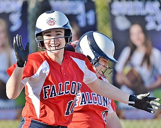 Jeff Lange | The Vindicator  TUE, MAR 29, 2016 - Austintown Fitch's Maddie Everhart celebrates on her way to the dugout after scoring a run late in the game against Poland Seminary Tuesday afternoon in Poland.