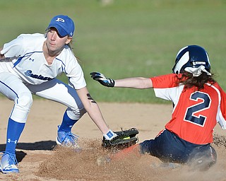 Jeff Lange | The Vindicator  TUE, MAR 29, 2016 - Poland Seminary shortstop Kat Wilson tags out Austintown baserunner Kaitlyn Sciorinto late in Tuesday's game in Poland.