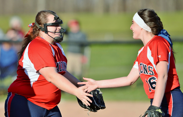 Jeff Lange | The Vindicator  TUE, MAR 29, 2016 - Fitch's Alex Franken (left) celebrates with second baseman Maddie Everhart after putting out a Poland baserunner during Tuesday afternoon's game in Poland.