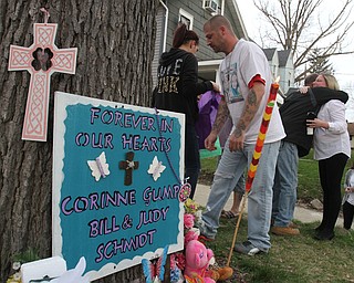 William D Lewis the vindicator Ethan Gump, father of Corinne Gump killed in fire one year ago and Lynn Schmidt Mother(getting hug)  during 3-30-16 vigil.