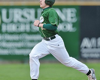 Jeff Lange | The Vindicator  WED, MAR 30, 2016 - Ursuline's Vito Petrillo sprints to third base in the bottom of the first inning of the Irish's game against Crestview Wednesday at Bob Cene Park in Struthers.