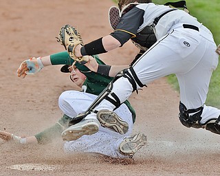 Jeff Lange | The Vindicator  WED, MAR 30, 2016 - Ursuline's Brice Bokesch (left) collides with Crestview catcher Jacob Wick as he is tagged out at home plate in the second inning of Wednesday's game at Bob Cene Park in Struthers.