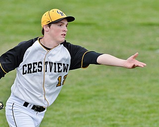 Jeff Lange | The Vindicator  WED, MAR 30, 2016 - Crestview's pitcher Dylan Dickey makes a toss to first to put out an Ursuline batter during Wednesday's game at Bob Cene Park in Struthers.