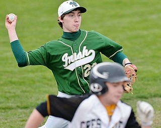 Jeff Lange | The Vindicator  WED, MAR 30, 2016 - Ursuline winning pitcher Vito Petrillo (top) looks to make a throw to first to put out a Crestview batter in the fourth inning of their game at Bob Cene Park in Struthers Wednesday afternoon.