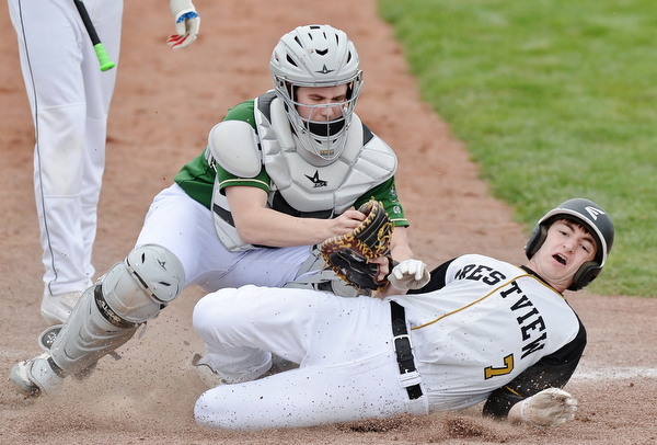 Jeff Lange | The Vindicator  WED, MAR 30, 2016 - Ursuline catcher Drew Potesta (top) puts the tag on Crestview's Joel Fitzsimmons as he attempts to steal home in the fourth inning of Wednesday's baseball game at bob Cene Park in Struthers. Ursuline defeated Crestview, 2-0.