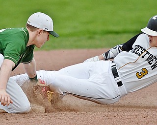 Jeff Lange | The Vindicator  WED, MAR 30, 2016 - Ursuline's second baseman Alex Schlosser (left) puts the tag as Crestview's Ty Fitzsimmons (3) slides into the bag late in Wednesday's game in Struthers.