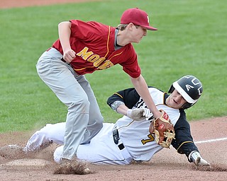 Jeff Lange | The Vindicator  THU, MAR 31, 2016 - Mooney third baseman Jake Fonderlin (top) puts the tag on Crestview's Joel Fitzsimmons in the fourth inning of their baseball game at Cene Park in Struthers Thursday afternoon.