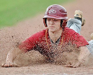 Jeff Lange | The Vindicator  THU, MAR 31, 2016 - Cardinal Mooney base runner Jake Fonderlin dives back to first to beat the throw from the mound in the fourth inning of Thursday's game against Crestview in Struthers.