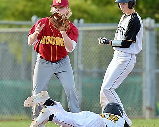 Jeff Lange | The Vindicator  THU, MAR 31, 2016 - Mooney shortstop Bryce Richey (left) catches a throw from the plate in time to tag out Crestview base runners Caleb Hill (bottom) and Andy Gorby as they both attempt to beat the throw to the bag in the seventh inning of Thursday's game at Cene Park in Struthers.