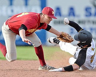 Jeff Lange | The Vindicator  THU, MAR 31, 2016 - Mooney second baseman Jack Lynch stretches out in attempt to tag Crestview base runner Tyler Hurd in the seventh inning of Thursday's game at Cene Park.